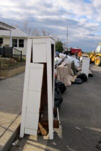 Destroyed Belongings Ready for the Dump Trucks